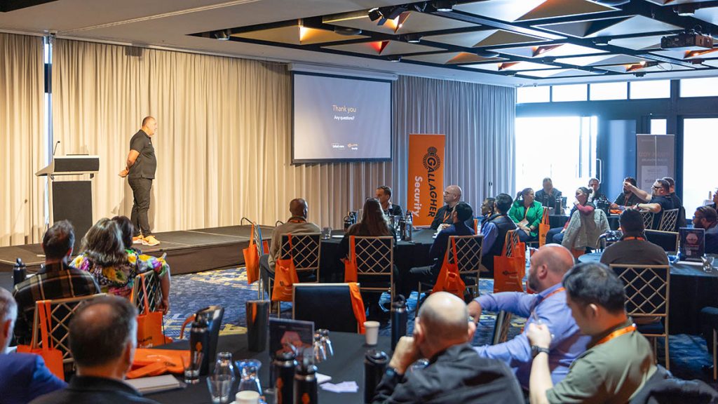 Gallagher Security Queensland Forum Brings Industry Expertise And Innovation 2 Speaker presenting at a conference.